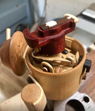 Illustration for article titled This Hand-Carved Wooden Volkswagen Engine Is a Thing of Strange and Staggering Beauty
